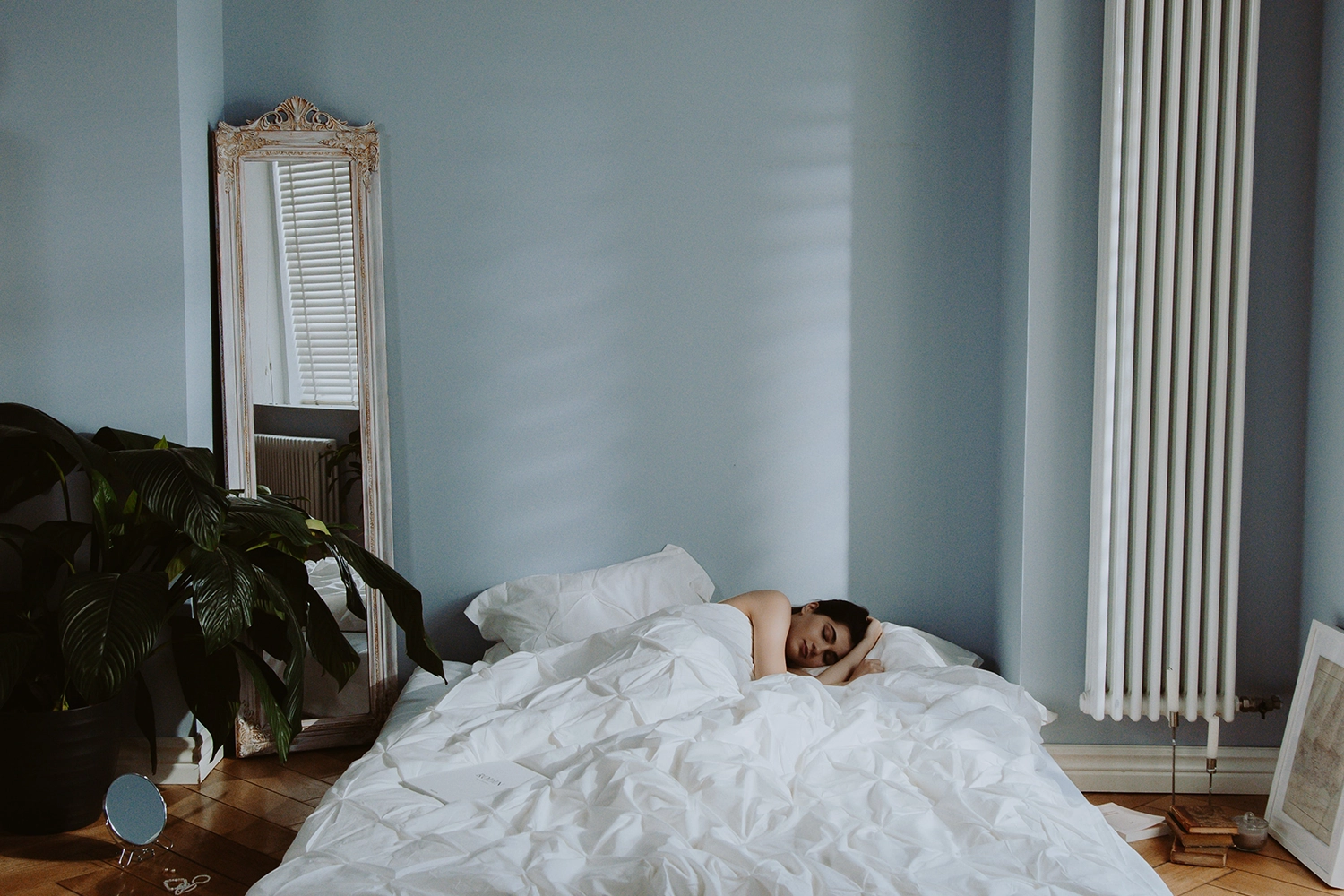 person lying down on side in bed